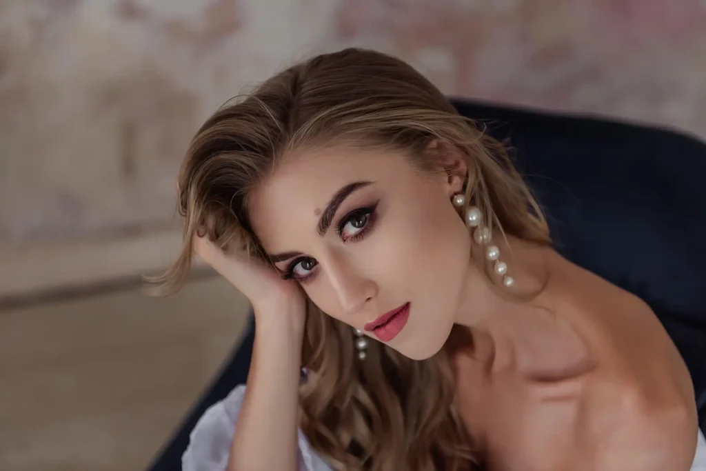 Woman with face rested on hand